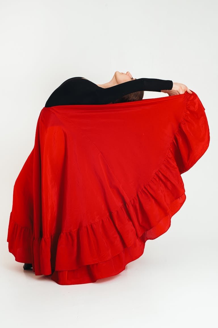 Young flamenco dancer with raised leg
